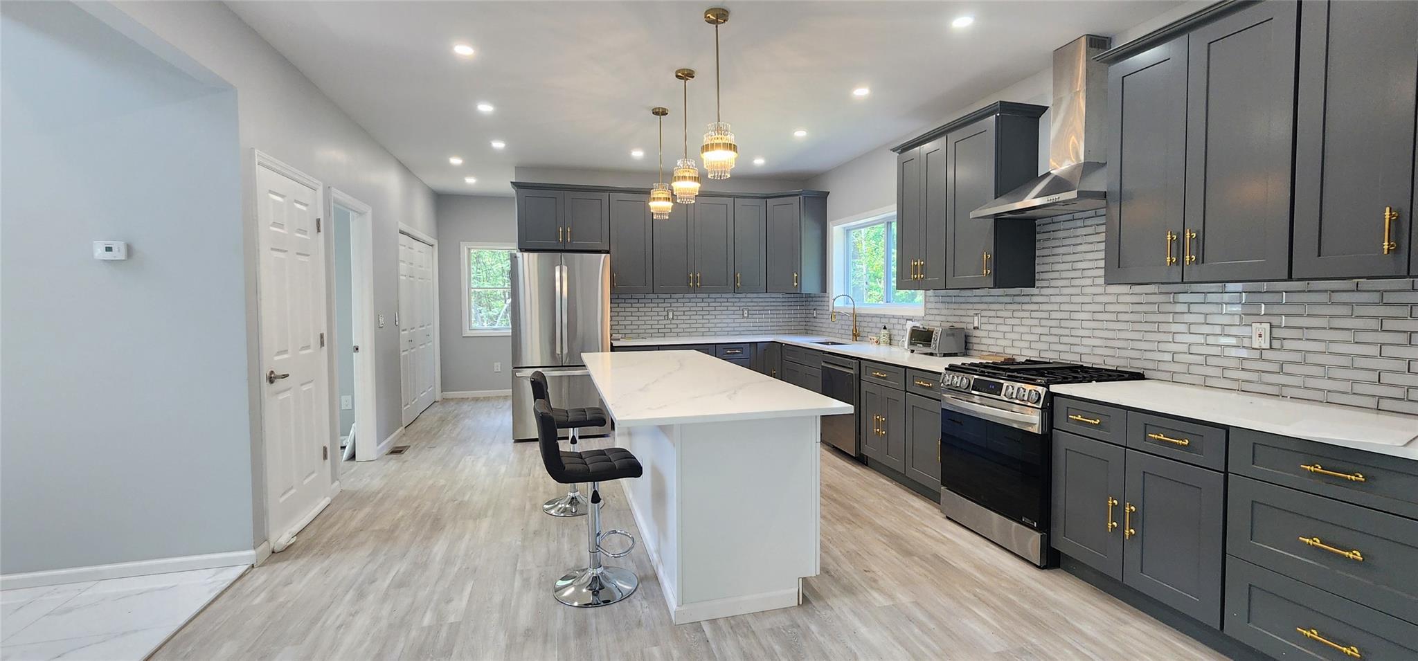 57 Haddock Road Monticello, NY 12701 - Photo 22 of 46 a kitchen with a sink appliances and wooden floor