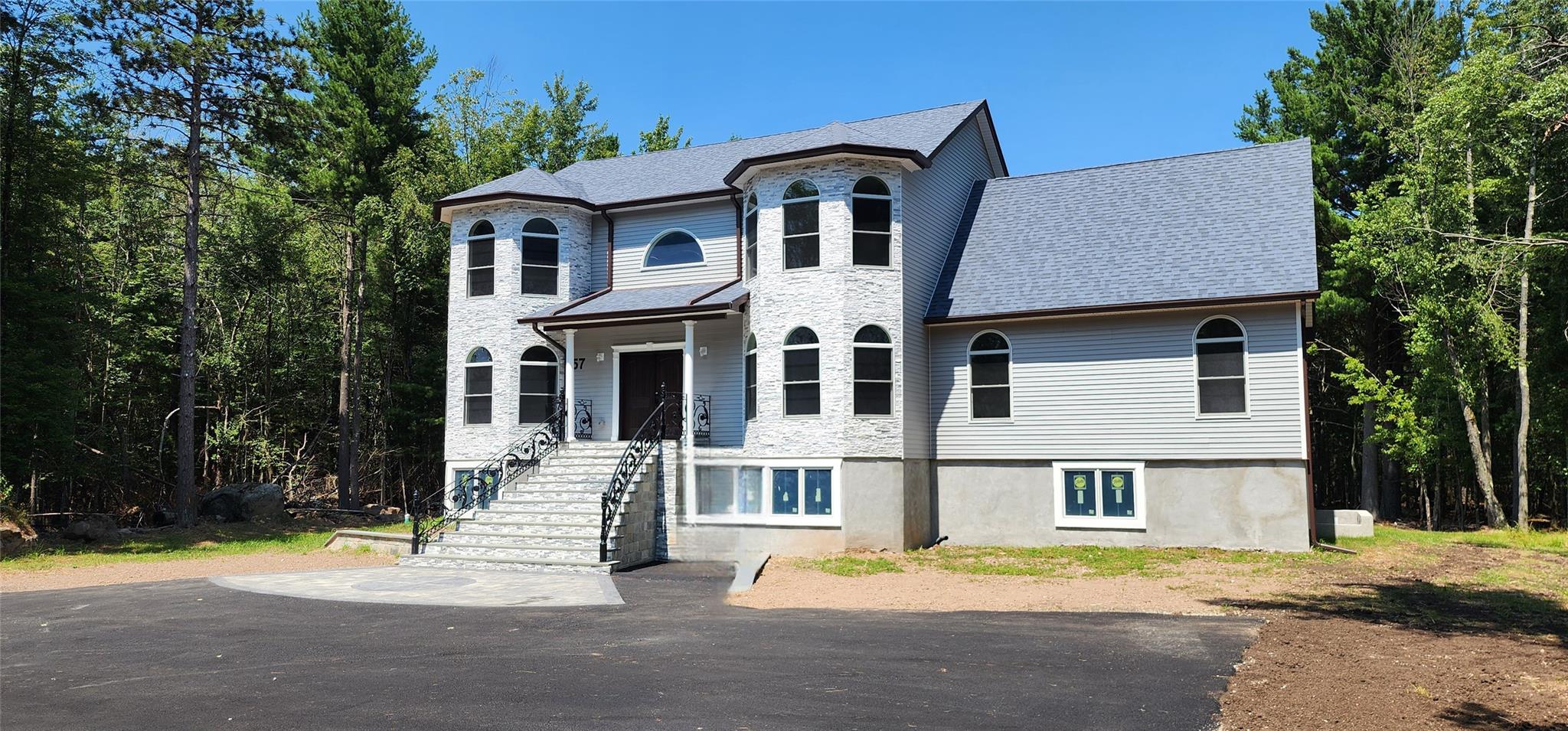 57 Haddock Road Monticello, NY 12701 - Photo 3 of 46 a front view of a house with a yard
