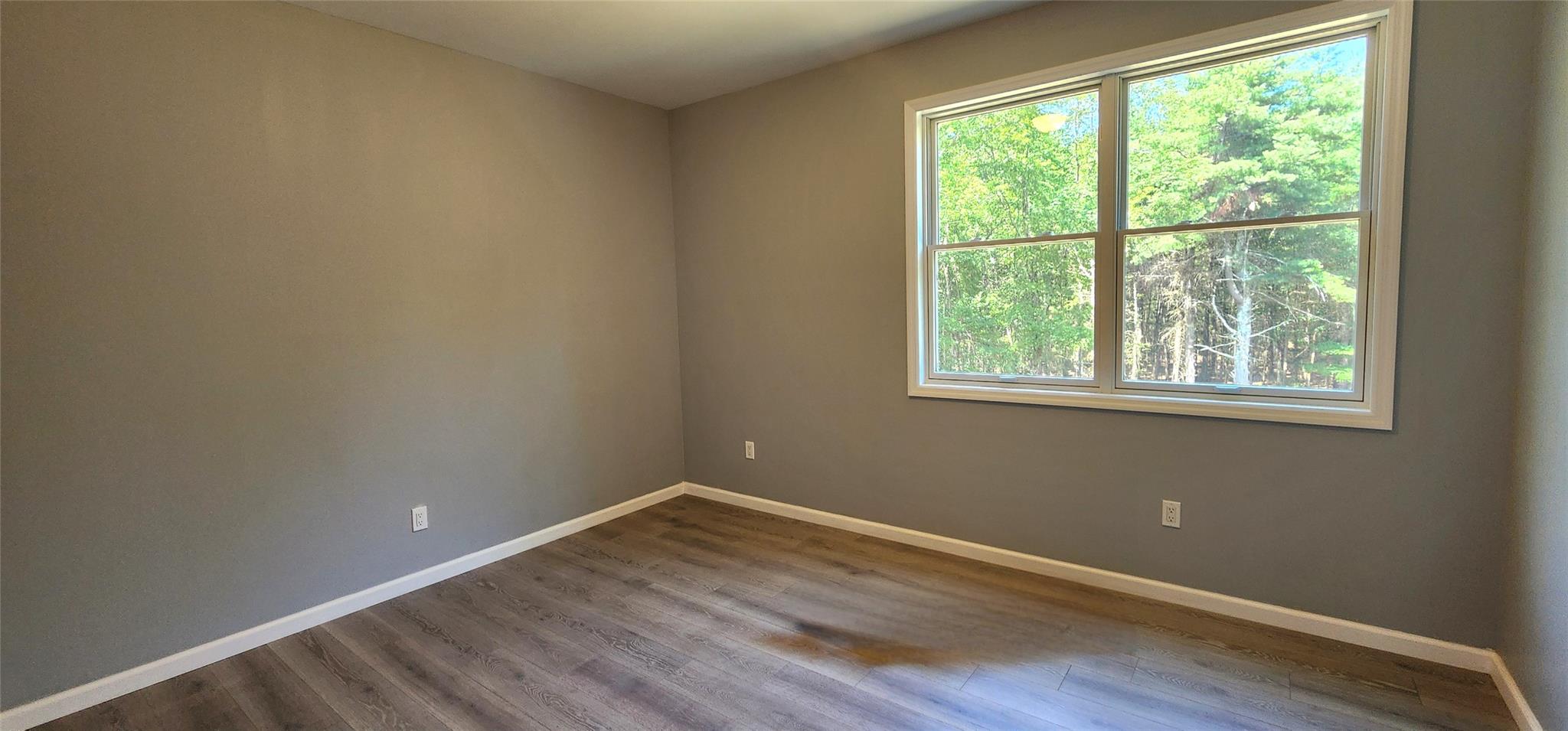 57 Haddock Road Monticello, NY 12701 - Photo 31 of 46 a view of a room with wooden floor and windows