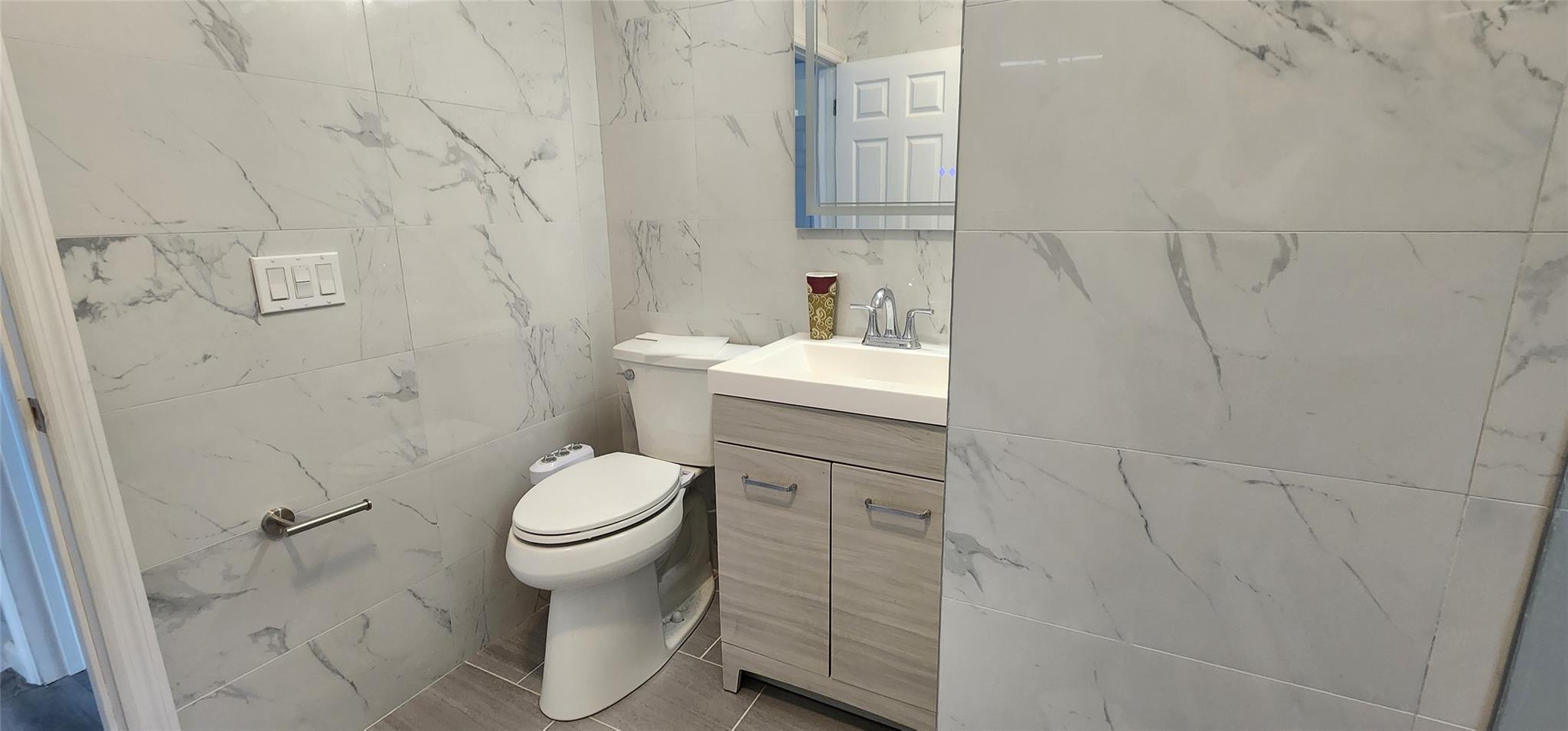 57 Haddock Road Monticello, NY 12701 - Photo 32 of 46 a bathroom with a sink toilet and a mirror