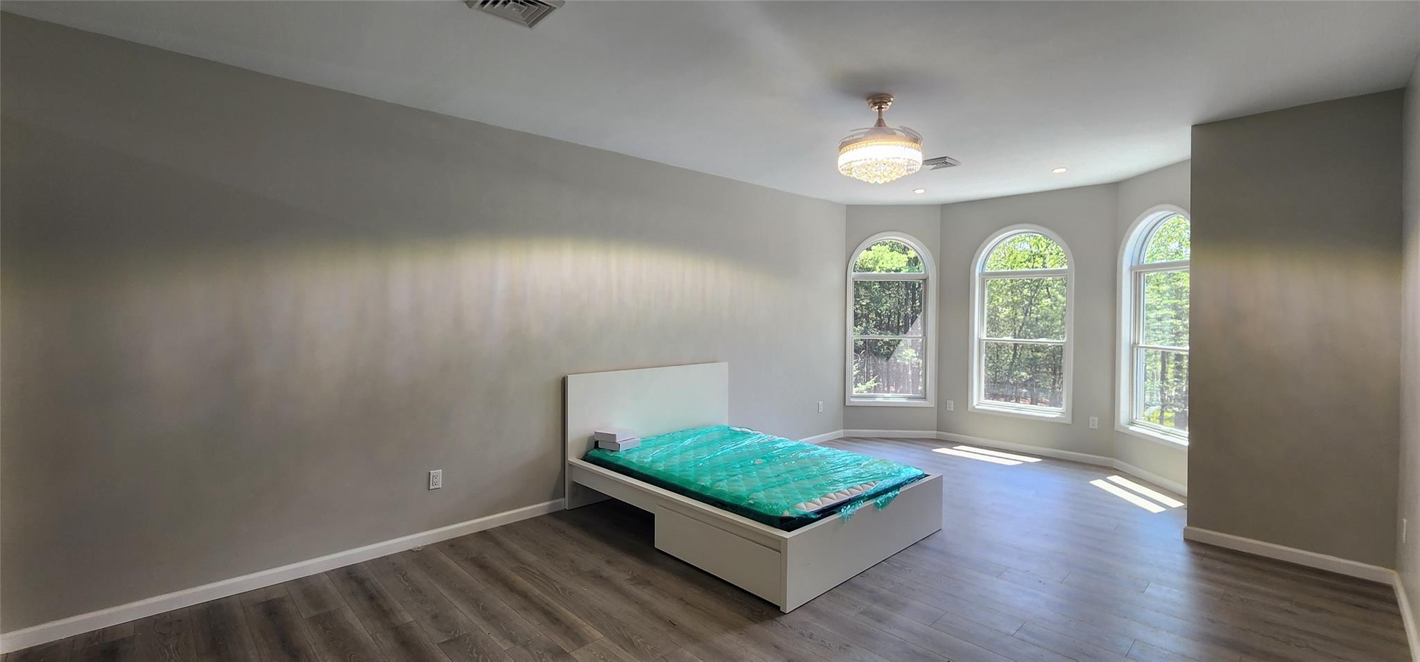57 Haddock Road Monticello, NY 12701 - Photo 36 of 46 an empty room with windows and ceiling fan
