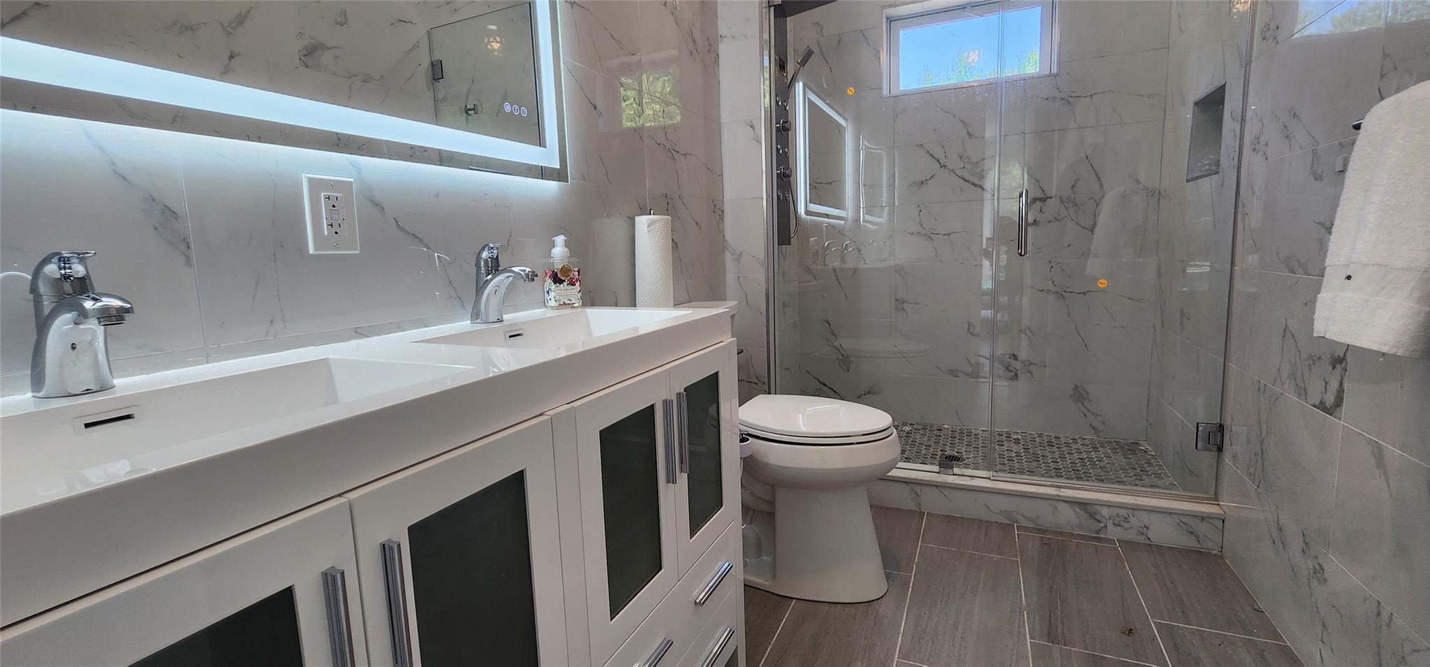 57 Haddock Road Monticello, NY 12701 - Photo 37 of 46 a bathroom with a sink a toilet and shower