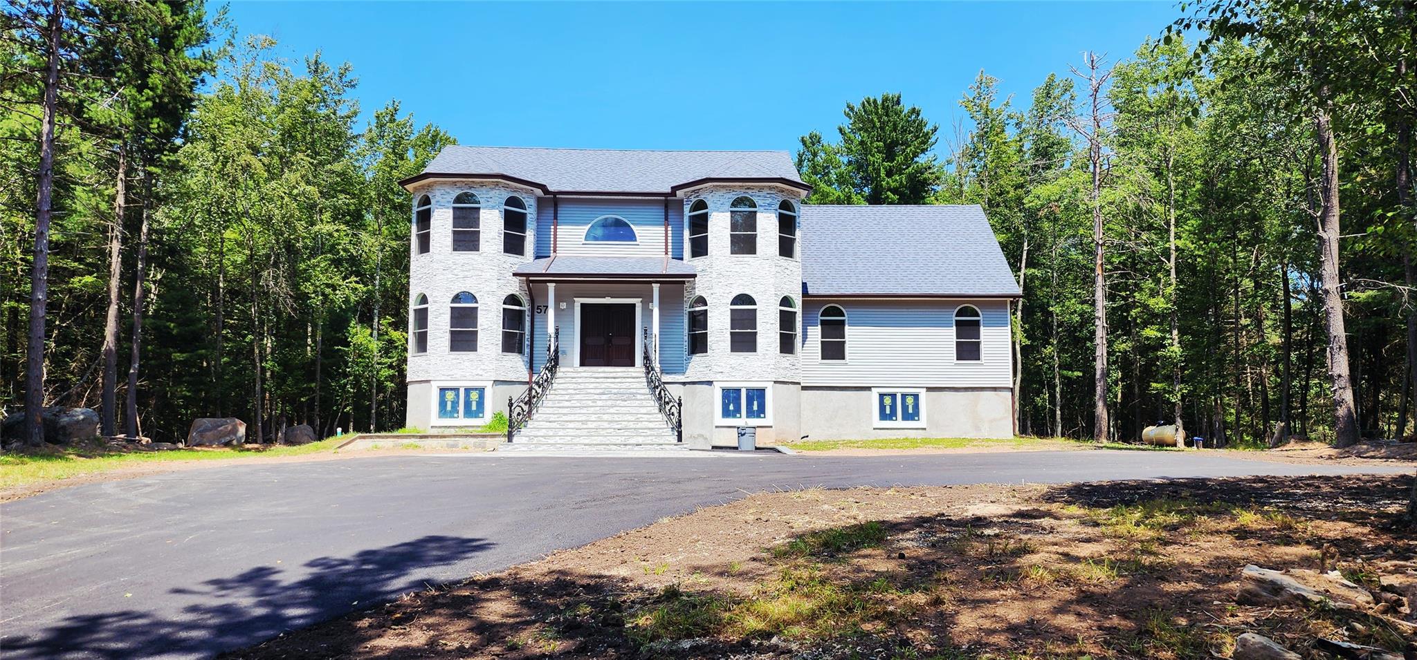 57 Haddock Road Monticello, NY 12701 - Photo 5 of 46 a view of multiple houses with yard and trees