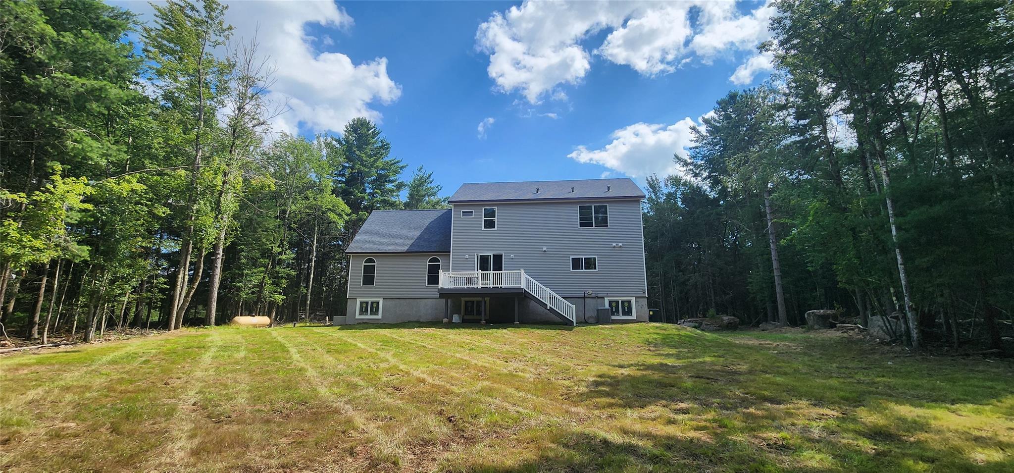 57 Haddock Road Monticello, NY 12701 - Photo 9 of 46 a front view of a house with a yard