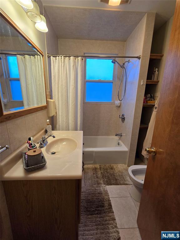 50 Columbia Avenue, Unit 2 Kearny, NJ 07032 - Photo 6 of 11 a bathroom with a sink a toilet and shower