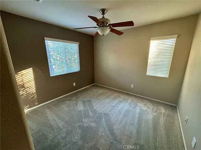 a view of an empty room and a window