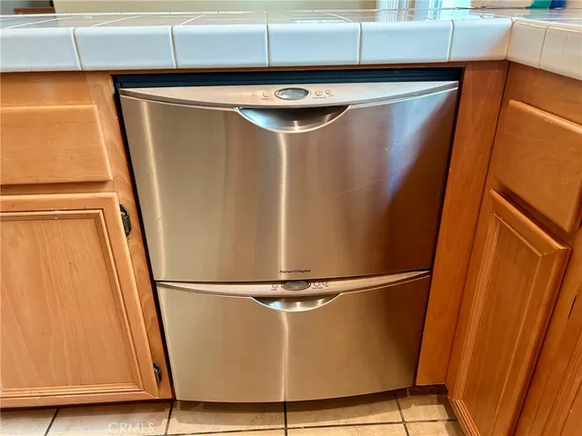 a view of a refrigerator with wooden floor