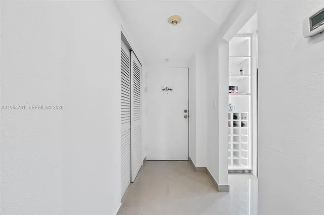 a view of a hallway with closet