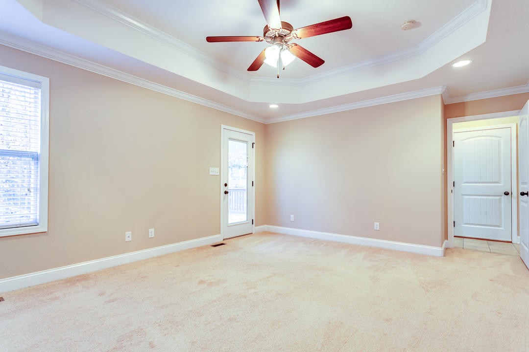 6067 Whisper Ridge Lane Corryton, TN 37721 - Photo 19 of 35 an empty room with fan and windows