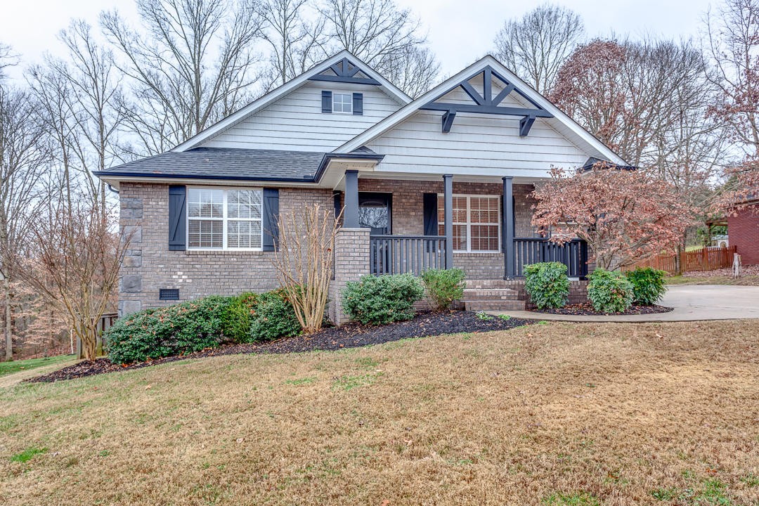 6067 Whisper Ridge Lane Corryton, TN 37721 - Photo 2 of 35 a front view of a house with yard and trees