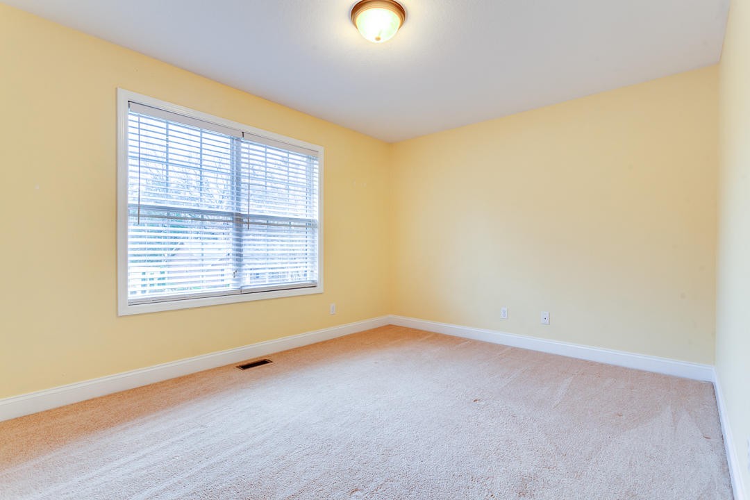 6067 Whisper Ridge Lane Corryton, TN 37721 - Photo 24 of 35 wooden floor in an empty room with a window