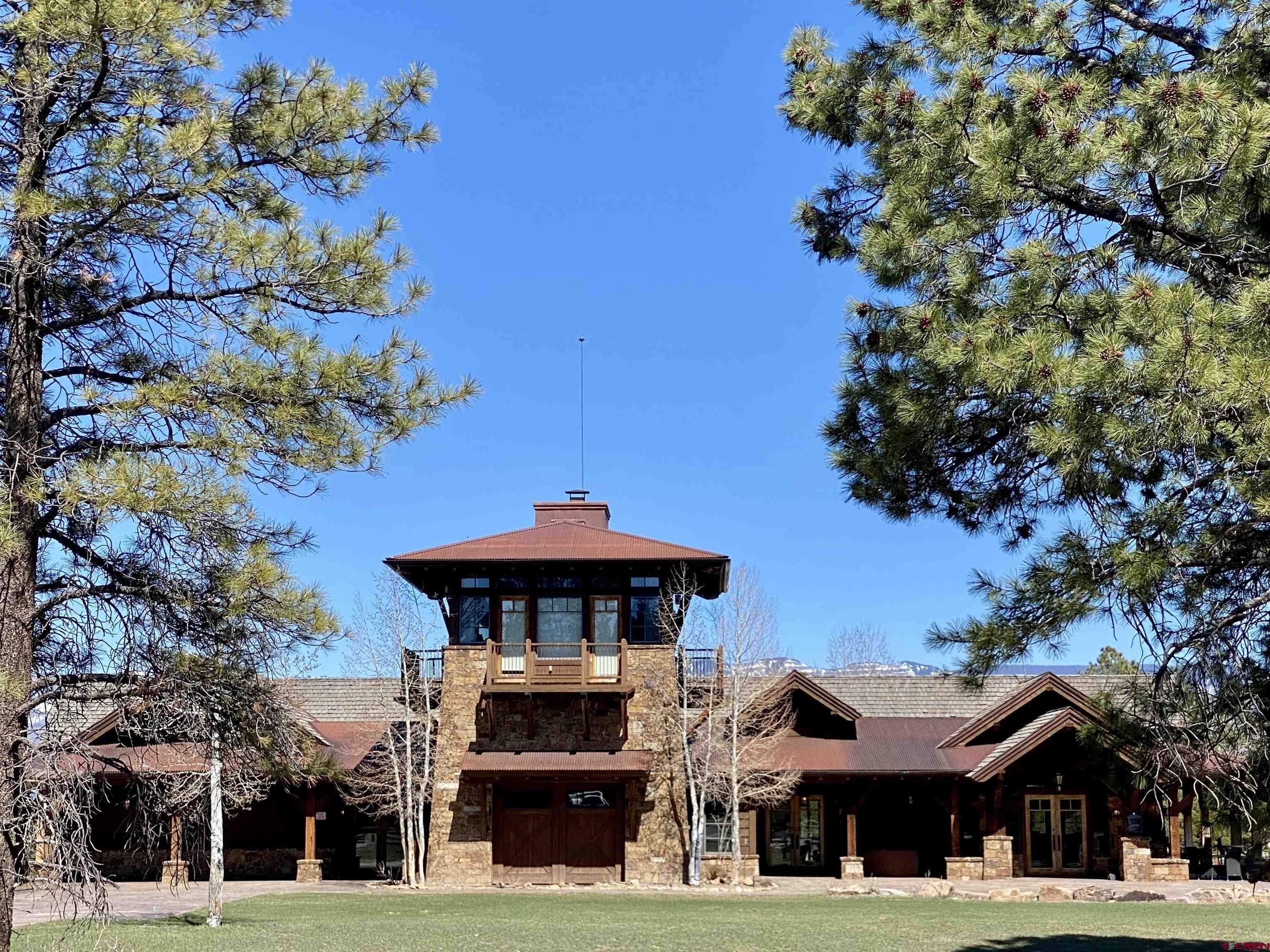 935 Marmot Drive Ridgway, CO 81432 - Photo 11 of 24 a front view of a building with a garden