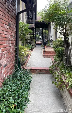 a front view of a building with garden