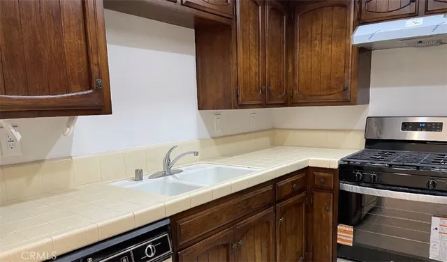 a kitchen with a sink and cabinets