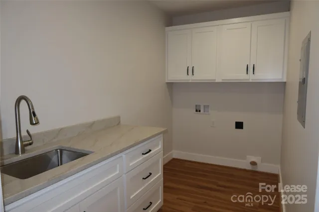 a kitchen with a sink and cabinets