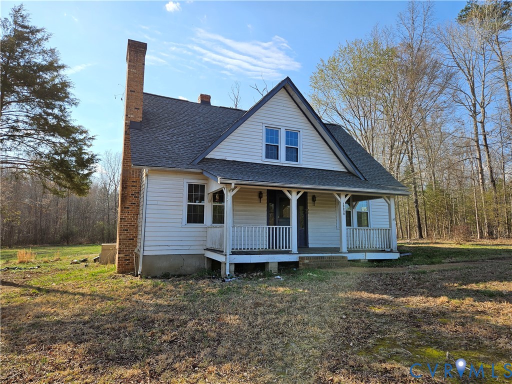 10030 Cheathams Road Amelia Court House, VA 23002 - Photo 1 of 23 a front view of a house with a yard