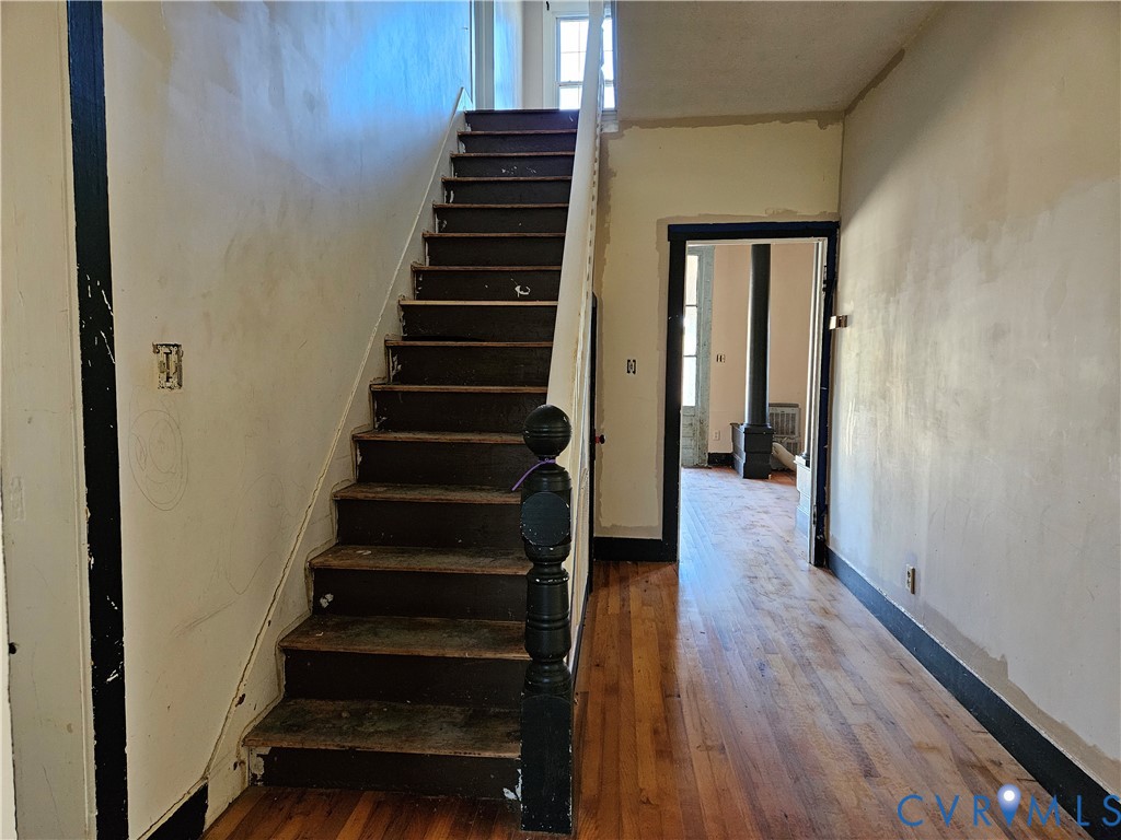 10030 Cheathams Road Amelia Court House, VA 23002 - Photo 15 of 23 a view of a hallway with wooden floor and entryway