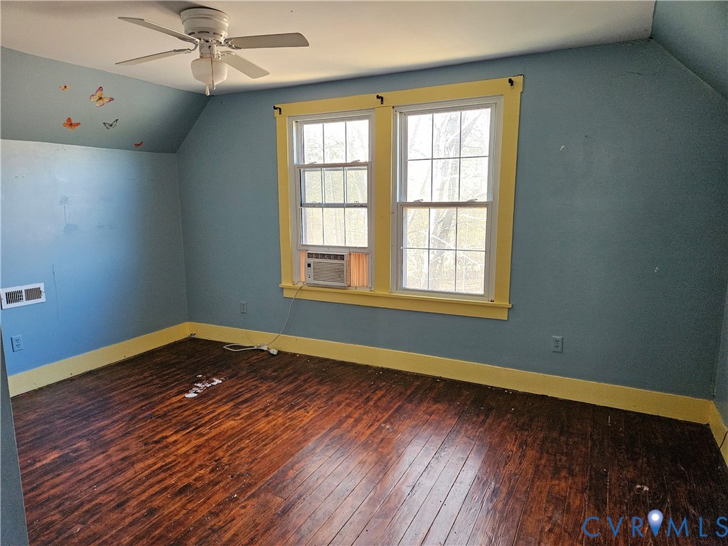 10030 Cheathams Road Amelia Court House, VA 23002 - Photo 17 of 23 a view of an empty room with wooden floor and a window