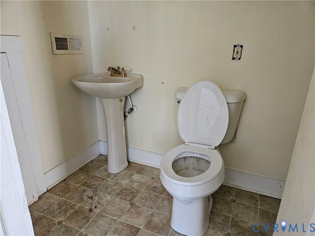 10030 Cheathams Road Amelia Court House, VA 23002 - Photo 20 of 23 a bathroom with a toilet and a sink