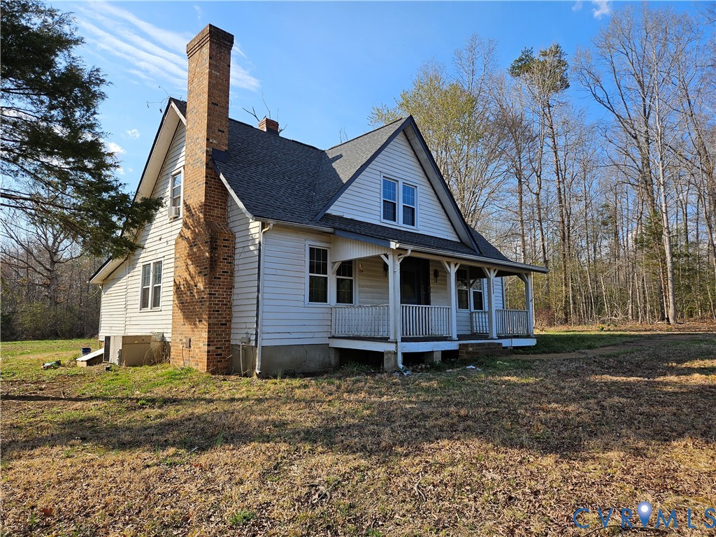 10030 Cheathams Road Amelia Court House, VA 23002 - Photo 2 of 23 a front view of a house with a yard