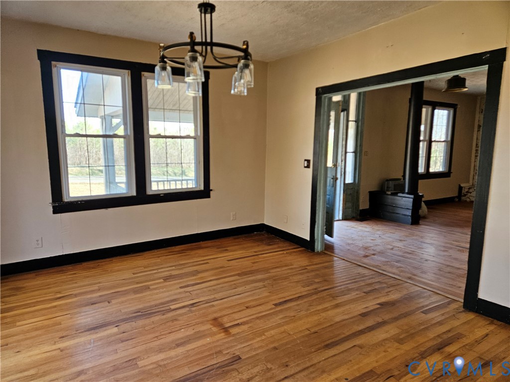 10030 Cheathams Road Amelia Court House, VA 23002 - Photo 8 of 23 a view of livingroom with hardwood floor and a ceiling fan