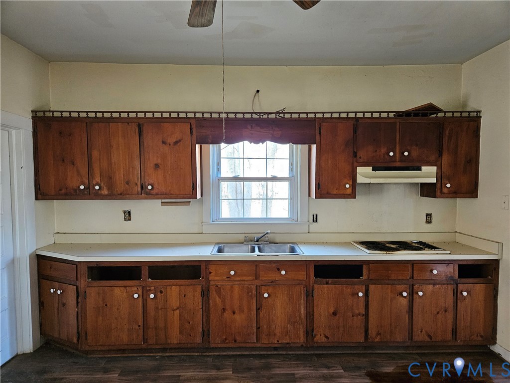 10030 Cheathams Road Amelia Court House, VA 23002 - Photo 9 of 23 a kitchen with granite countertop a sink cabinets and stainless steel appliances