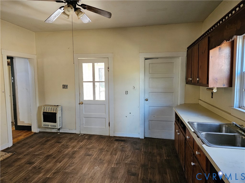 10030 Cheathams Road Amelia Court House, VA 23002 - Photo 10 of 23 a kitchen that has a sink and a stove in it