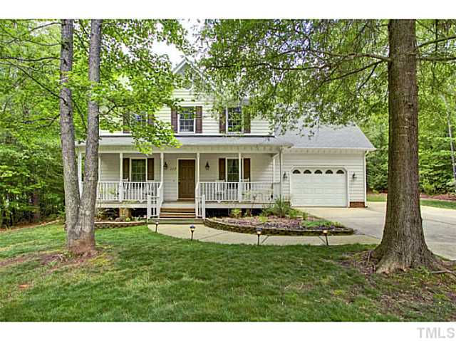 1117 Urania Drive Raleigh, NC 27603 - Photo 1 of 25 a front view of a house with a yard table and chairs