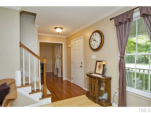 1117 Urania Drive Raleigh, NC 27603 - Photo 2 of 25 a view of a hallway with washer and dryer