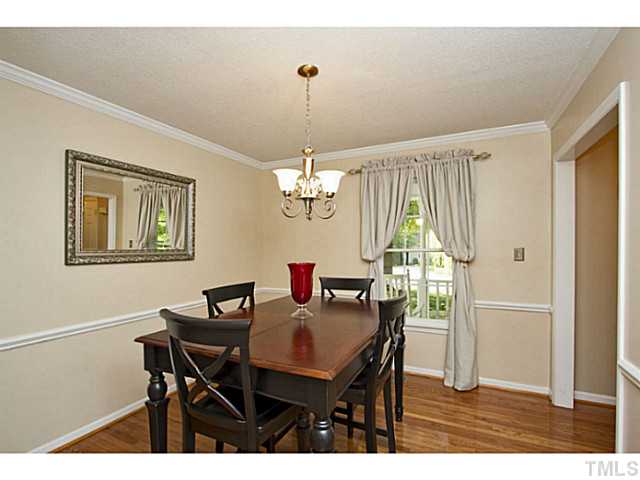 1117 Urania Drive Raleigh, NC 27603 - Photo 11 of 25 a view of a dining room with furniture window and wooden floor