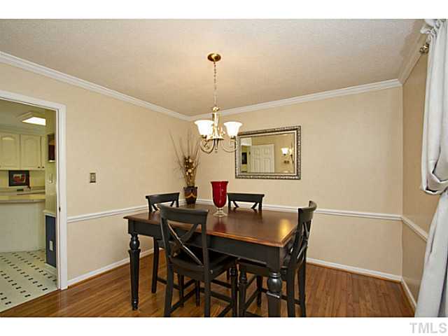 1117 Urania Drive Raleigh, NC 27603 - Photo 12 of 25 a view of a dining room with furniture and chandelier