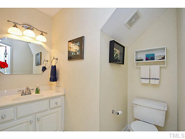 1117 Urania Drive Raleigh, NC 27603 - Photo 13 of 25 a bathroom with a sink vanity and mirror