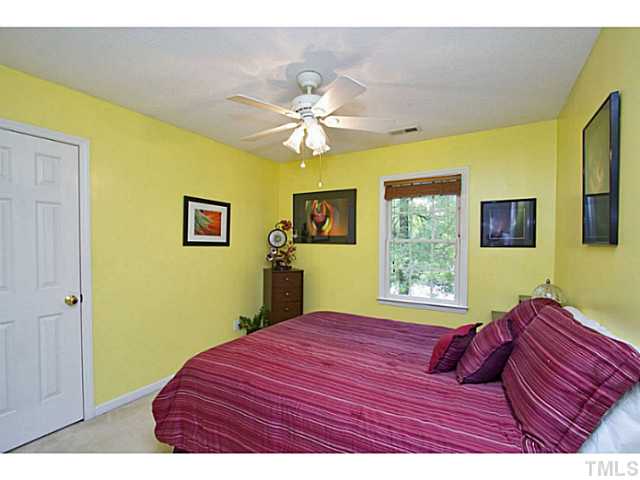 1117 Urania Drive Raleigh, NC 27603 - Photo 23 of 25 a bedroom with a bed and a window
