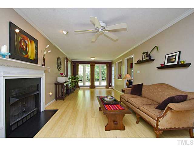 1117 Urania Drive Raleigh, NC 27603 - Photo 4 of 25 a living room with furniture and a fireplace