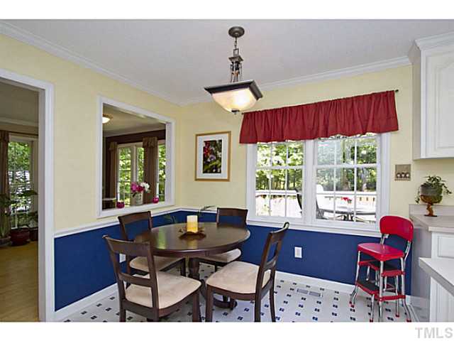 1117 Urania Drive Raleigh, NC 27603 - Photo 8 of 25 a view of a dining room with furniture window and outside view