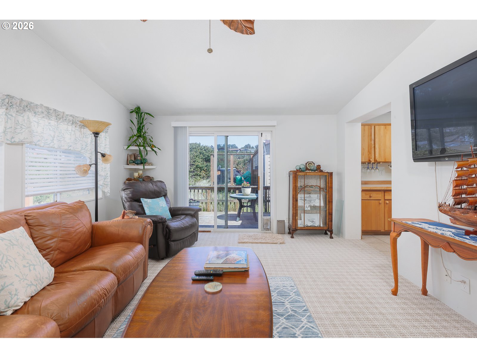 2018 Northwest Oceanic Loop Waldport, OR 97394 - Photo 14 of 35 a living room with furniture and a flat screen tv