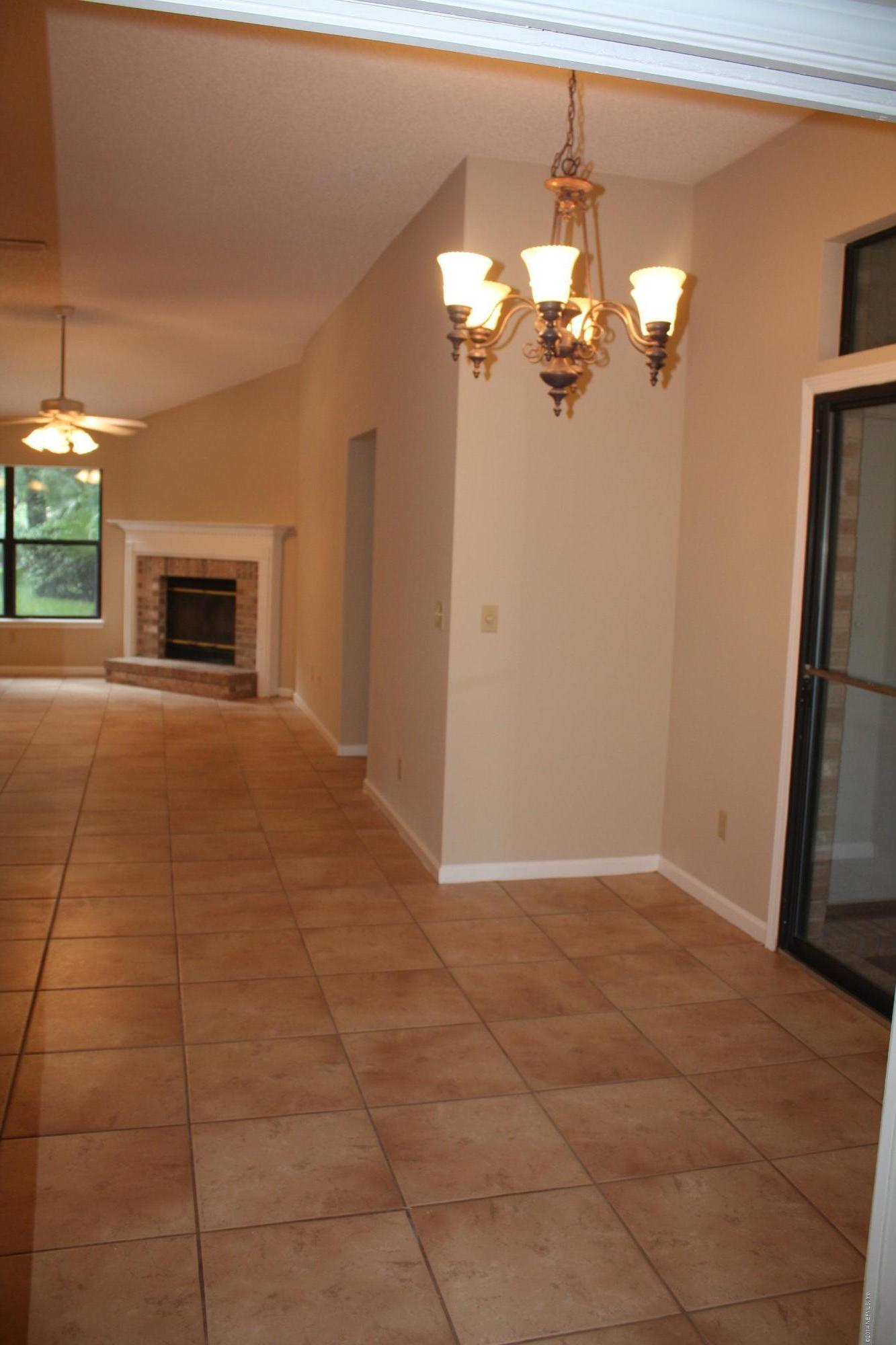 3060 Nautilus Road Middleburg, FL 32068 - Photo 11 of 40 a view of a livingroom with a fireplace