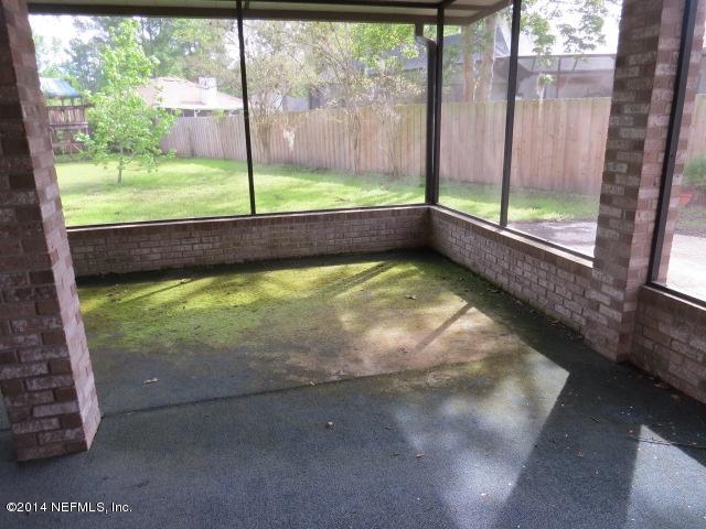 3060 Nautilus Road Middleburg, FL 32068 - Photo 23 of 40 a view of water heater room with green walls