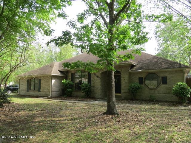 3060 Nautilus Road Middleburg, FL 32068 - Photo 29 of 40 a front view of a house with garden