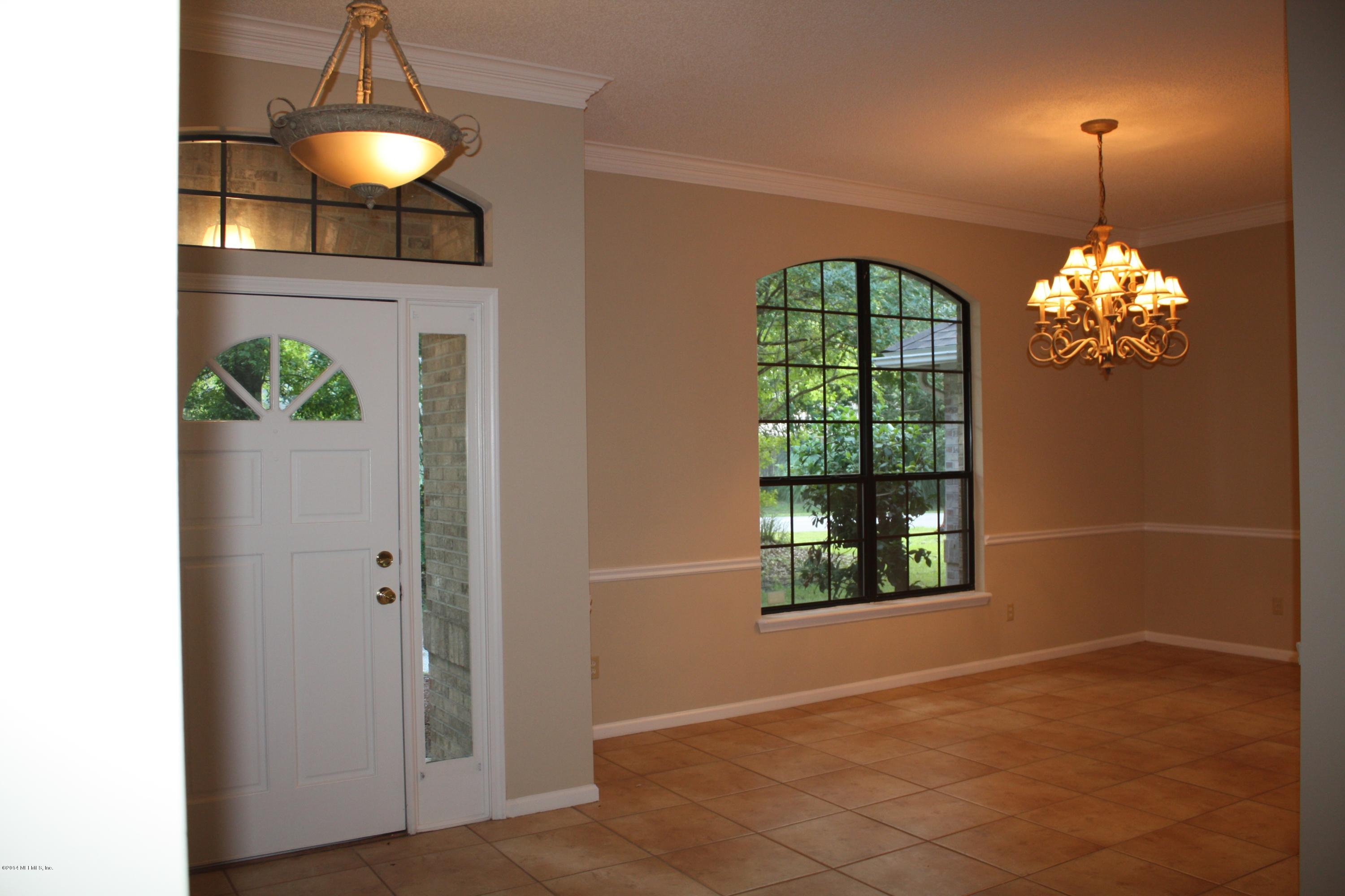 3060 Nautilus Road Middleburg, FL 32068 - Photo 3 of 40 a view of livingroom with chandelier