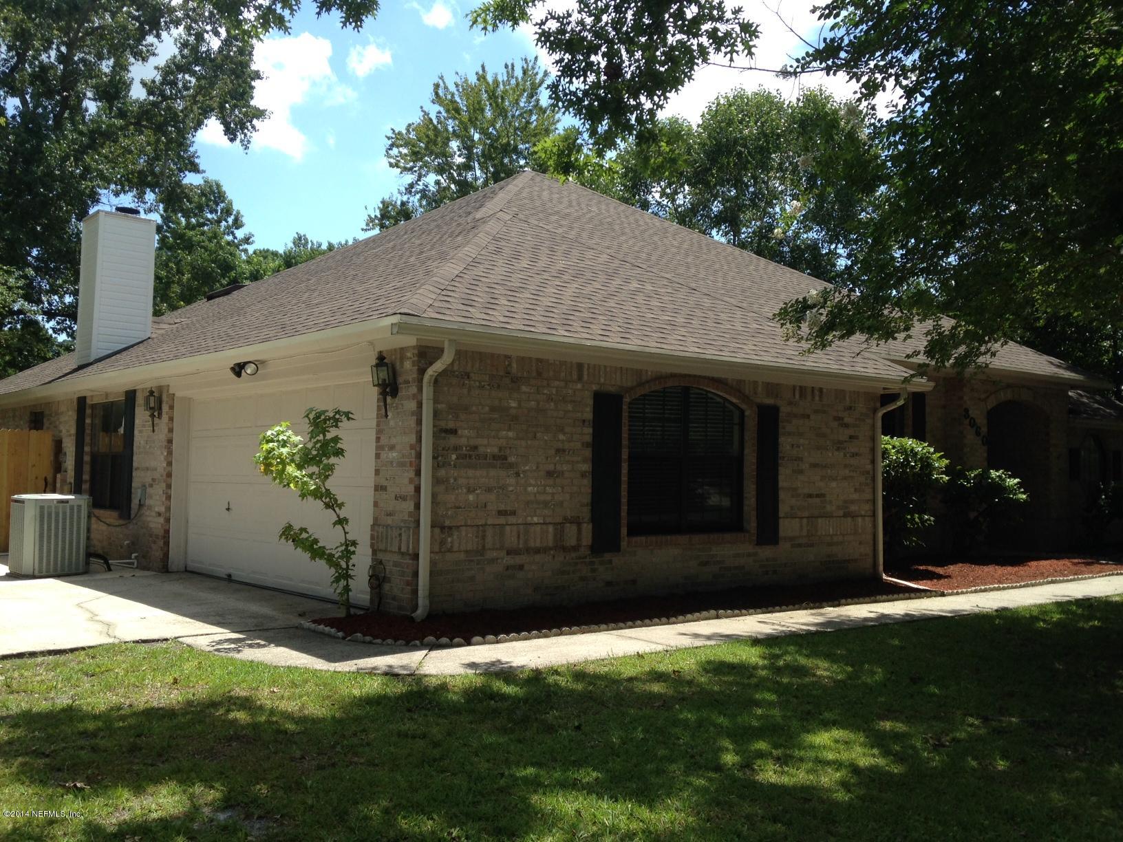 3060 Nautilus Road Middleburg, FL 32068 - Photo 36 of 40 a view of a house with a yard