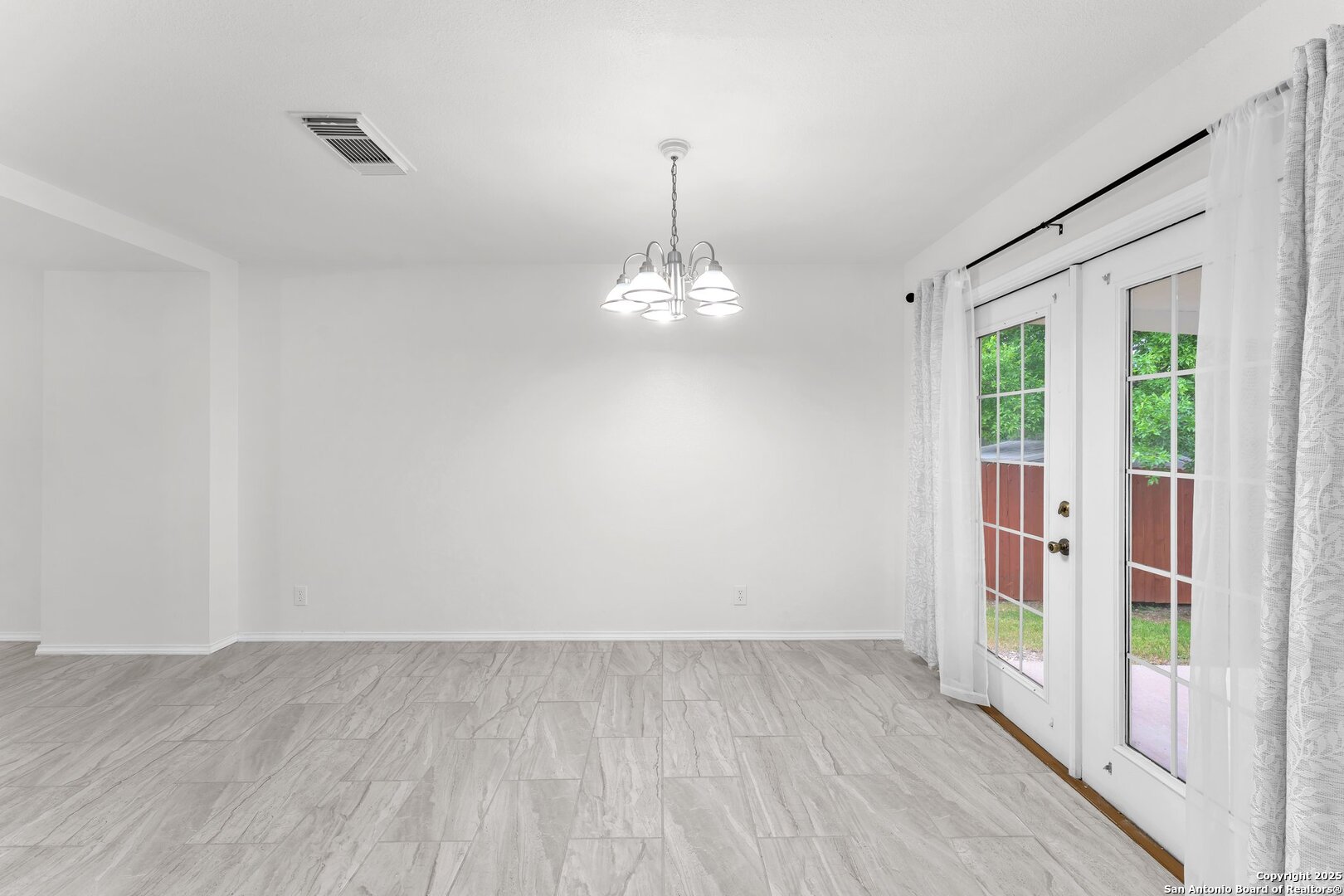 15515 Spring Summit San Antonio, TX 78247 - Photo 12 of 36 a view of a room with wooden floor and windows