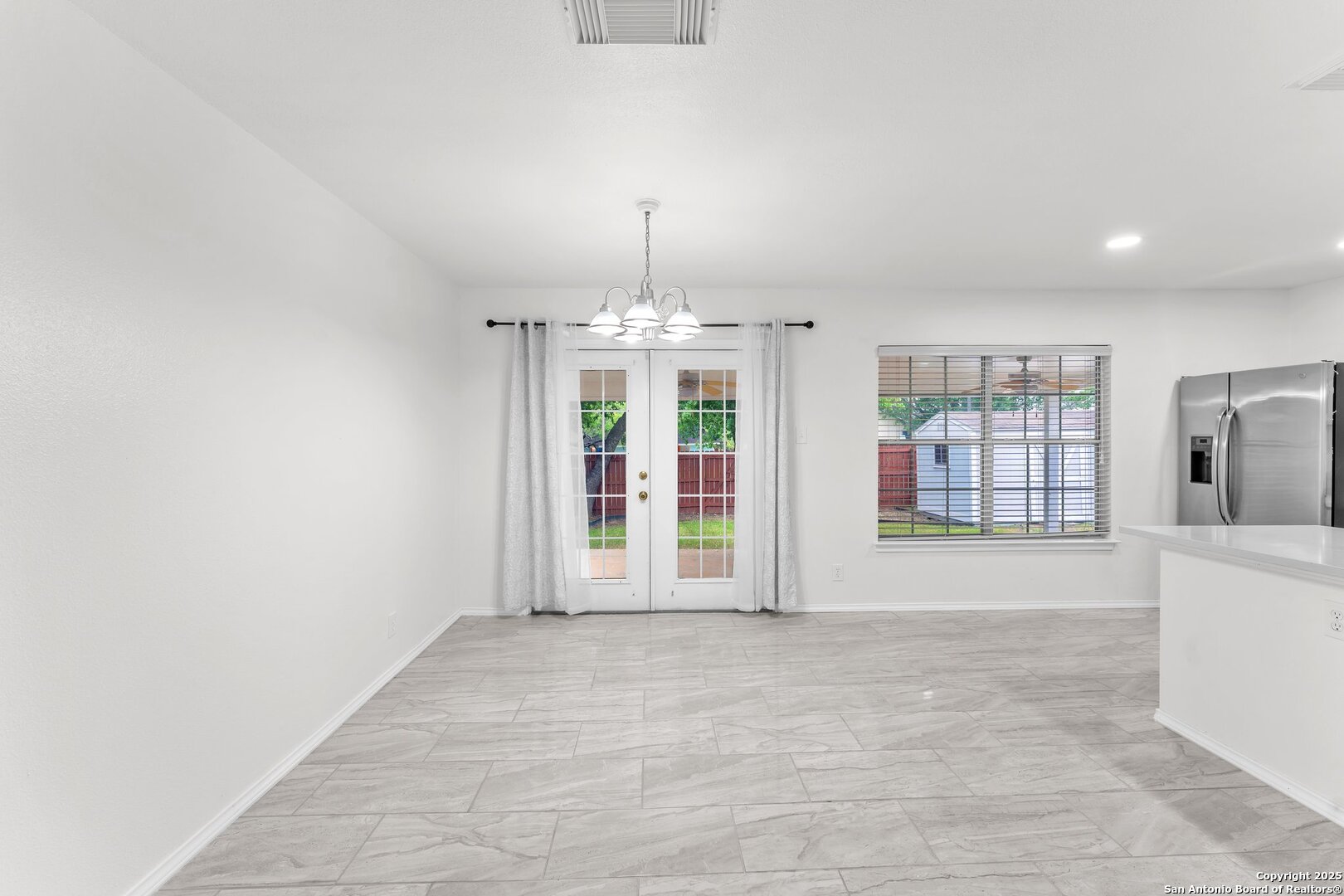 15515 Spring Summit San Antonio, TX 78247 - Photo 13 of 36 a view of an empty room with a window
