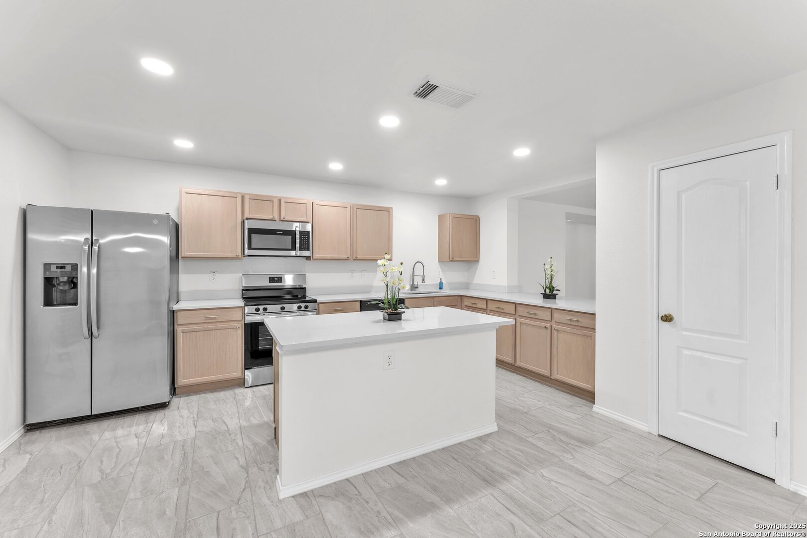15515 Spring Summit San Antonio, TX 78247 - Photo 14 of 36 a large kitchen with a center island stainless steel appliances cabinets and a counter top space