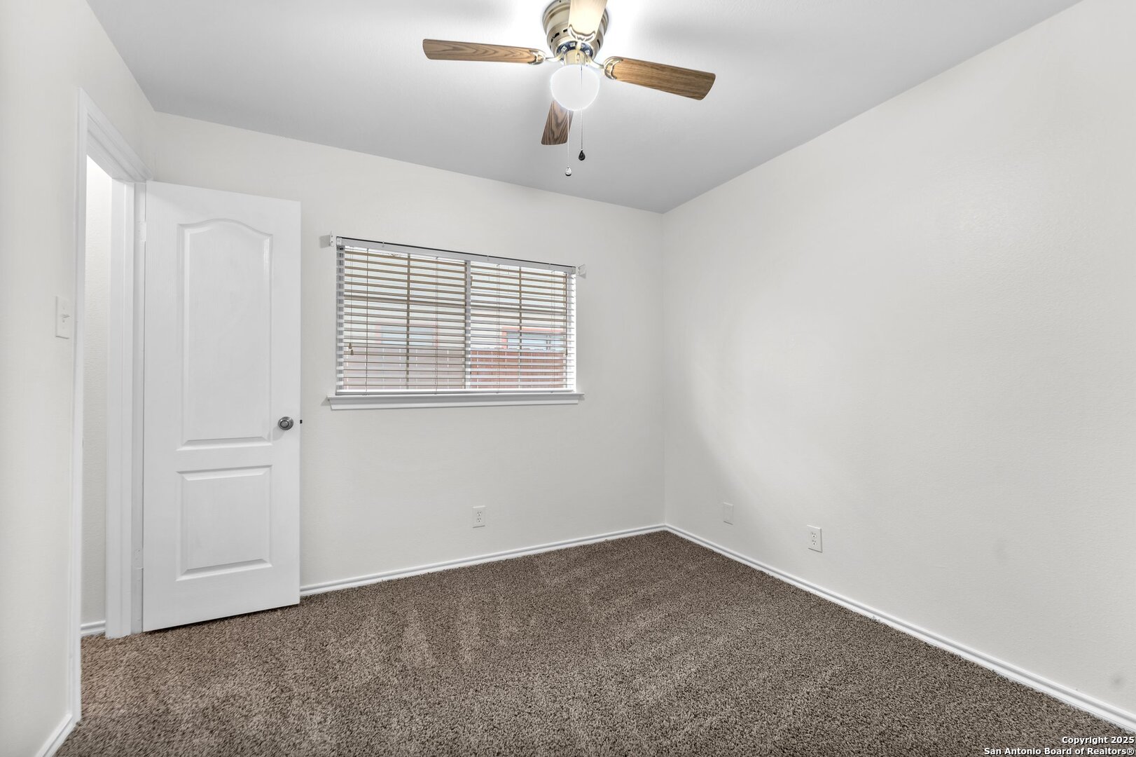 15515 Spring Summit San Antonio, TX 78247 - Photo 22 of 36 a view of an empty room with a window