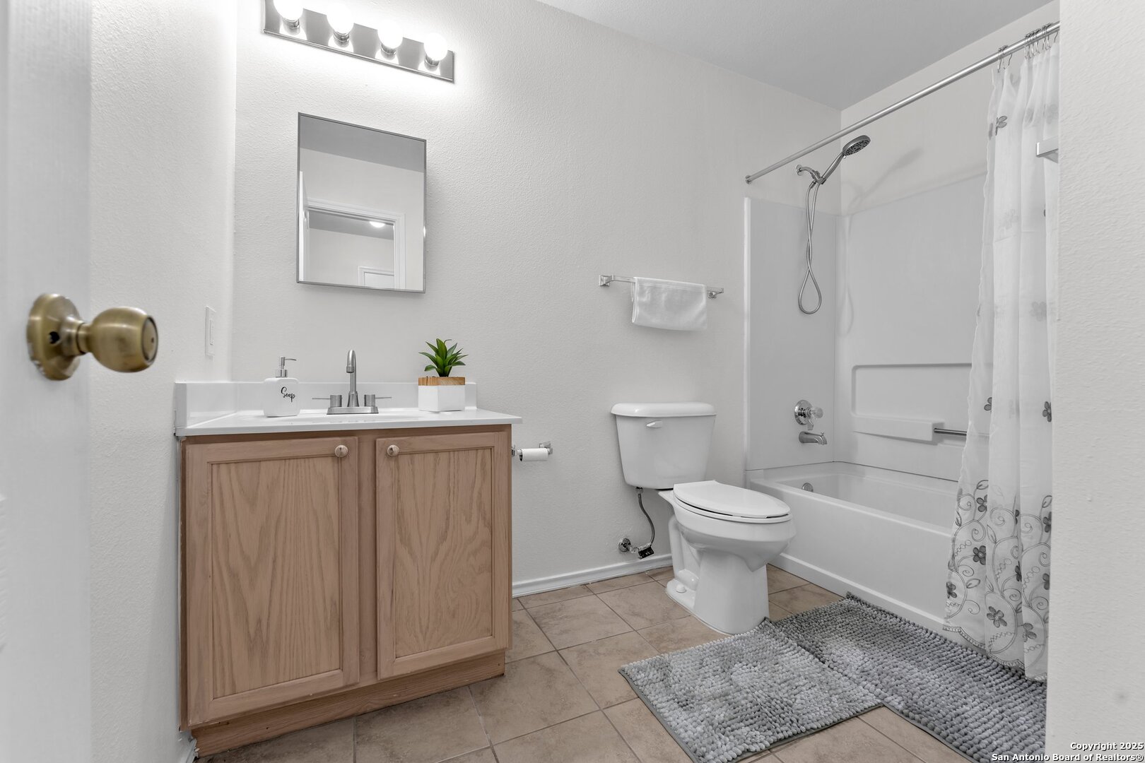 15515 Spring Summit San Antonio, TX 78247 - Photo 23 of 36 a bathroom with a sink a toilet and shower