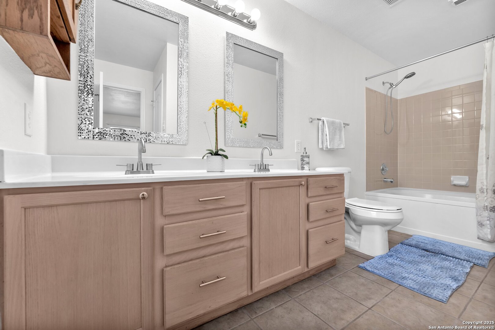 15515 Spring Summit San Antonio, TX 78247 - Photo 27 of 36 a bathroom with a double vanity sink toilet mirror and bathtub