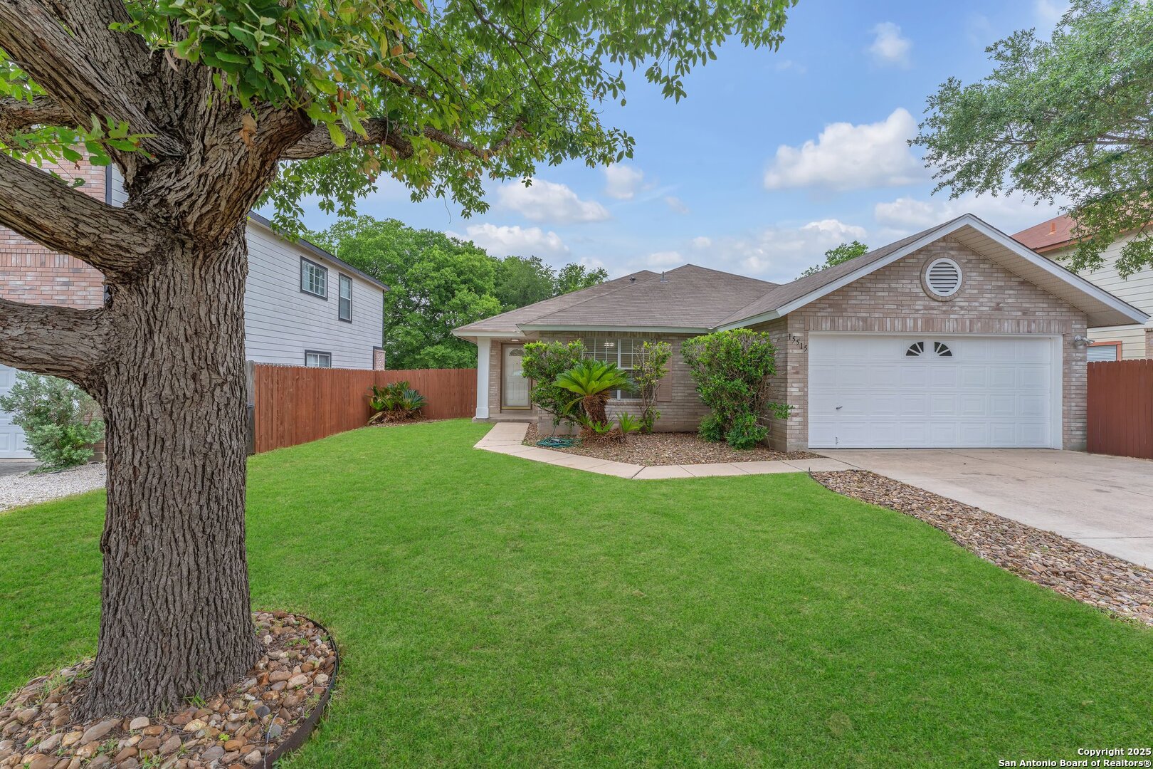 15515 Spring Summit San Antonio, TX 78247 - Photo 3 of 36 a view of an house with backyard space and garden