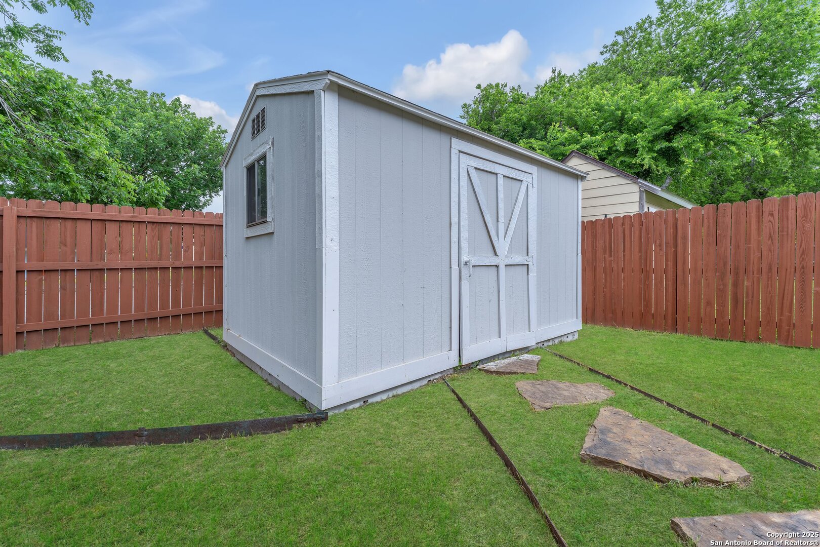 15515 Spring Summit San Antonio, TX 78247 - Photo 33 of 36 a view of backyard with tub and trees