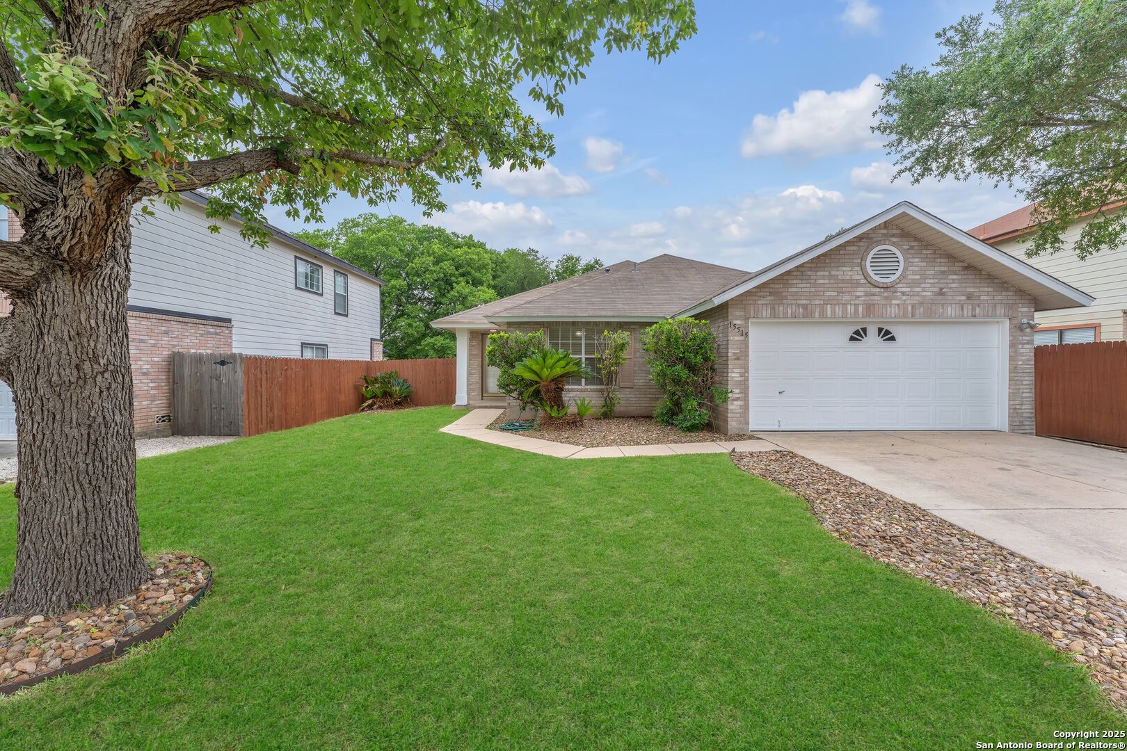 15515 Spring Summit San Antonio, TX 78247 - Photo 5 of 36 a front view of a house with garden